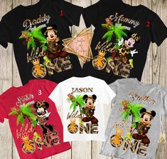 three mickey mouse shirts, one with the number one on it and two with palm trees