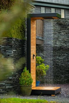 an outdoor shower with water coming out of it