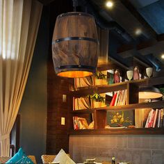 a dining room filled with lots of furniture next to a book shelf full of books