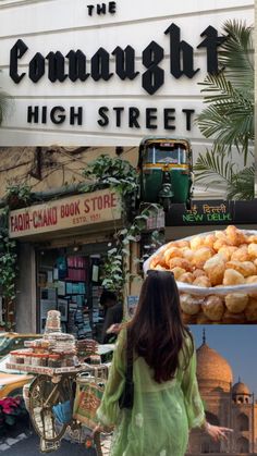 there is a woman that is standing in front of the building with food on it