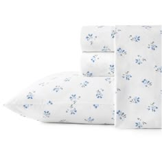 three sheets with blue flowers on them