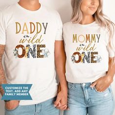 two people wearing matching shirts with the words daddy and mommy on them