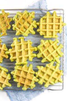 several waffles are cooling on a rack