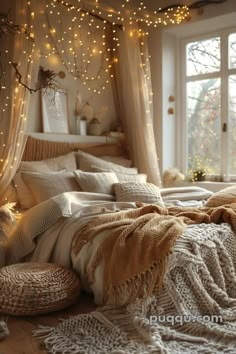 an unmade bed with lights hanging from the ceiling and curtains on the windowsill