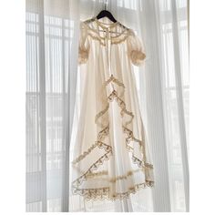 A long sheer cardigan with a sheer feel that will make you look like a princess of royalty. Lace embroidery decorates the edges, giving it a transparent and pure atmosphere. Wear it with a dress or jumper skirt. 
 

 

 
 
 Size 
 
 
 S size 
 
 Length: 112cm 
 Shoulder width: 35cm 
 
 M size 
 
 Length: 116cm 
 Shoulder width: 36cm 
 
 
 
 
 
 Material 
 
 Polyester 
 Rayon 
 
 
 Model worn 
 
 Wearing size 
 
 S size 
 
 Model dimensions 
 
 Height: 165cm Feminine Sheer Floor-length Dress, Sheer Feminine Floor-length Dress, Long Sheer Lace Dress, Sheer Long Wedding Dress, Long Sheer Wedding Dress, Elegant Long Dress With Lace Work, Sheer Long Daywear Dresses, Long Sheer Dress For Daywear, Sheer Flowy Lace Dresses