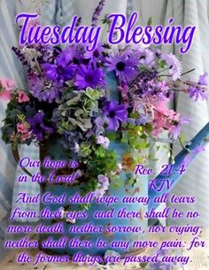 a blue watering can with purple flowers in it and the words tuesday blessing written below