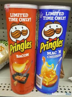 two packages of pringles are sitting on the shelf