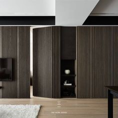 an open room divider with wooden slats on the walls