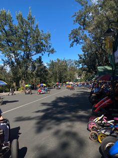 people are riding motorcycles down the street