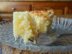 a close up of a piece of cake on a plate with a fork in it