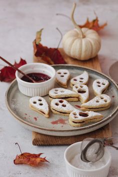 some cookies are sitting on a plate with dipping sauce