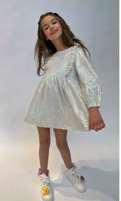 Description: Soft shimmer hologram dots make this dress so sparkly and magical This dress is the perfect outfit for your next party Pair it with your favorite boots and some jewelry to complete the look Material & Care: Gentle wash in cold Do Not Iron Do Not Bleach Do Not Dry Clean Hang Dry Glitter Party Outfit, Hologram Dress, Glitter Party, Favorite Boots, Kids Fashion Girl, Perfect Outfit, Photo Sessions, Madonna, Party Outfit