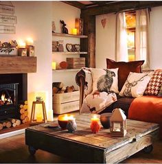 a living room filled with furniture and a fire place