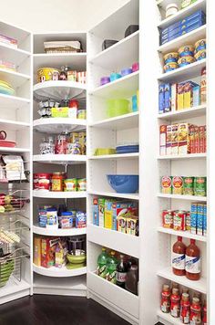 an organized pantry with white shelving and lots of food