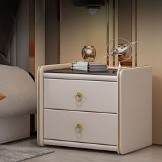 a night stand with two drawers and a lamp on top