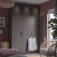 a bedroom with pink walls and white furniture