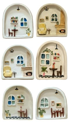 four plates with different designs on them and some furniture in the same pattern, all painted white