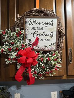 a christmas wreath with a cardinal on it