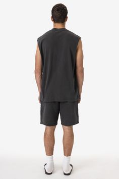 A sleeveless, cutoff version of our bestselling 1801GD Garment Dye T-shirt. This unisex muscle tank features a crew neckline with deep, raw-hemmed sleeves. Made of 100% USA cotton, this textile is beefy, durable, and absorbent, and is virtually shrink free as a result of garment dyeing. The garment is washed with natural enzymes, resulting in a broken-in feel, just like a T-shirt that was washed or worn for a decade or two. Made in Los Angeles, Calif. Our experienced sewers earn up to $25 an hou Lace Knitwear, Kids Garments, Denim Workwear, Sweater Jumpsuit, Denim Sweater, Sleeveless Tee, Leather Denim, Sleeveless Tshirt, Active Wear Leggings