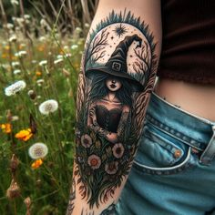 a woman with a hat on her head and flowers in front of her arm is standing next to some wildflowers