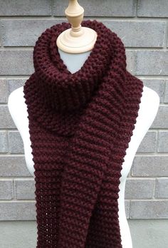 This beautiful hand knitted scarf is made with super bulky Wool Blend Yarn (80% Acrylic, 20% Wool). The pattern  looks the same on both sides. The scarf can be worn in multiple ways. Amazing color for the fall/winter season. It goes with everything. The color may appear slightly different on different monitors. Measures: 79" (200 cm) long x 8.5" (22-23 cm) wide. From a smoke-free home. Care instructions: Hand wash in cool water and dry flat. Bulky Knit, Hand Knit Scarf, Super Bulky, Long Scarf, Wool Scarf, Merlot, Knit Scarf, Winter Season, Scarf Wrap