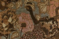 an image of a peacock and flowers on a fabric background that is brown, pink, blue, orange and black