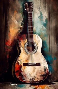 an acoustic guitar sitting on top of a wooden table in front of a wall with paint splatters