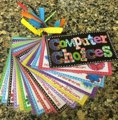 the computer choices cards have been placed on top of each other, and are decorated with colorful ribbons