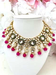 Gold Kundan and Hot Pink Indian Bridal Jewelry Set | Punjabi Jewelry | Kundan Jewelry Set | Sheeshphool, Matha Patti, Paranda, Punjabi Jutti This set is STUNNING and perfect for a mehndi/sangeet event. It features kundan setting stones, and hot pink accent beads. The matching earrings and tikka tie the whole set together.  This jewelry set includes: -1 necklace with adjustable gold cord -1 maang tikka (headpiece) -1 pair of matching earrings Shop more Indian jewelry sets here: https://www.etsy.c Kundan Sheeshphool, Tikka Headpiece, Punjabi Jewelry, Indian Bridal Jewelry, Matha Patti, Jewelry Kundan, Kundan Jewellery Set, Indian Bridal Jewelry Sets, Punjabi Jutti