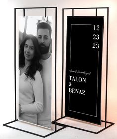 a black and white photo frame with a couple on it