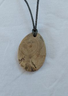 This unique pendant is made from walnut tree branches. Nature inspired unique design. Only you will have this, because each wood is different and one of a kind. Due to its low weight, it offers a high wearing comfort. It's best to avoid direct contact with water. I cut and sand the wooden slices for the pendants myself. This pendant is made of walnut tree branches which can be of different shape so each one of them is a unique piece. Walnut Tree, Wooden Slices, Wooden Necklace, Wood Necklace, Wooden Pendant, Wood Pendant, Unique Pendant, Different Shapes, Walnut Wood