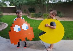 two young boys dressed up as pacman and an orange pacman