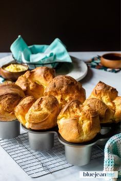 several muffins in tins on a cooling rack