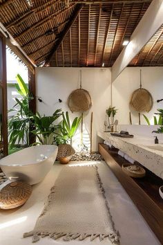 a large bathroom with two sinks and a bathtub in the middle of the room