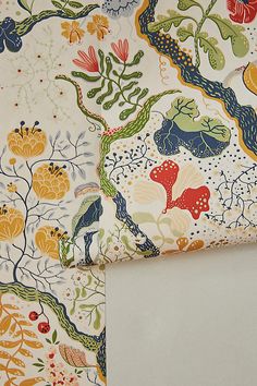 a close up of a wallpaper with flowers and plants on it, next to a window