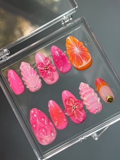 Hand painted gel press ons, made to order. Pink and orange tropical themed nails with 3D fruit and flowers.Medium almond shown in images. Each press on set comes with a set of application tools. I recommend ordering a sizing kit to know your nail size! Beach Aura Nails, 3d Nail Art Fruit, Beach Orange Nails, Nails Theme Ideas, Almond Seashell Nails, 3d Orange Nails, Pink And Orange Hibiscus Nails, Fruit Almond Nails