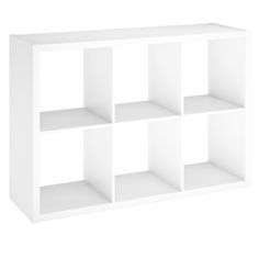 a white shelf unit with four shelves on each side and one section missing from the wall