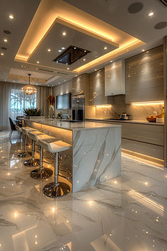 an elegant kitchen with marble counter tops and bar stools in the middle of the room