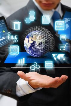 a man in a business suit holding up a tablet with icons on it and an earth globe