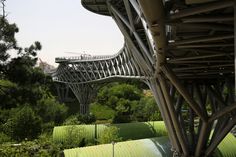 a bridge that is going over some trees