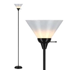 a lamp that is sitting next to a light on a pole with a black base