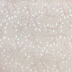 a white and pink fabric with leaves on it