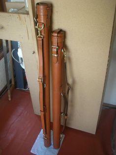 two brown suitcases sitting next to each other