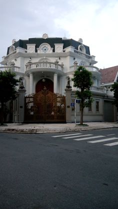 a large white building with a clock on it's front