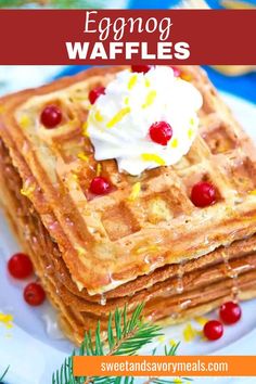 a plate with the best eggnog waffles one on top of others