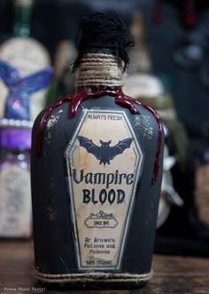 a bottle of vampire blood sitting on top of a table