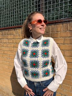 Expertly handmade with granny square patterns, these knit warm vests are the perfect addition to any wardrobe. These unique cardigans are not only a statement piece, but also a thoughtful and one-of-a-kind gift.  M A T E R I A L: - Cotton yarn, Acrylic yarn - Hand-knitted - 100% Handmade S I Z I N G: Fits to EU36-40, UK8-14, US2-7 It can be customised depending on your measurements/size. If you are unsure about the size or want to customise the size, please message me before your purchase. M O D Gilet Granny Square, Handmade Casual Vest, Crochet Granny Square Sweater Vest, Crochet Granny Square Cardigan Pattern, Granny Square Sweater Vest, Granny Square Top Crochet, Grandma Square Crochet, Granny Square Pullover, Crochet Granny Square Sweater