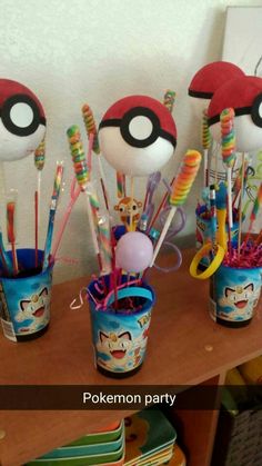 some toothbrushes and other items in cups on a table with the words pokemon party