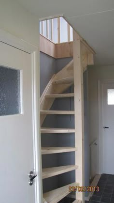 an open door leading to a staircase in a house