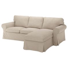 a white couch with a footstool sitting on it's side and the cover pulled down